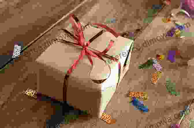 A Beautiful Gift Box Wrapped In Red Ribbon On A Wooden Table The Psychological Benefits Of Gifting: A Gift Has The Ability To Change Your Life