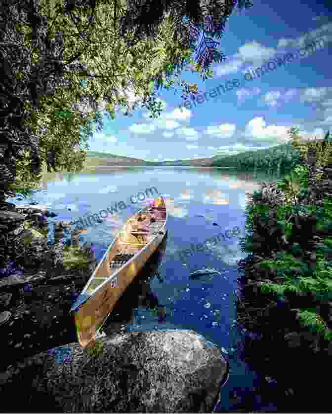 A Canoe Gliding Through The Tranquil Waters Of The Boundary Waters Canoe Area Campfires And Loon Calls: Travels In The Boundary Waters