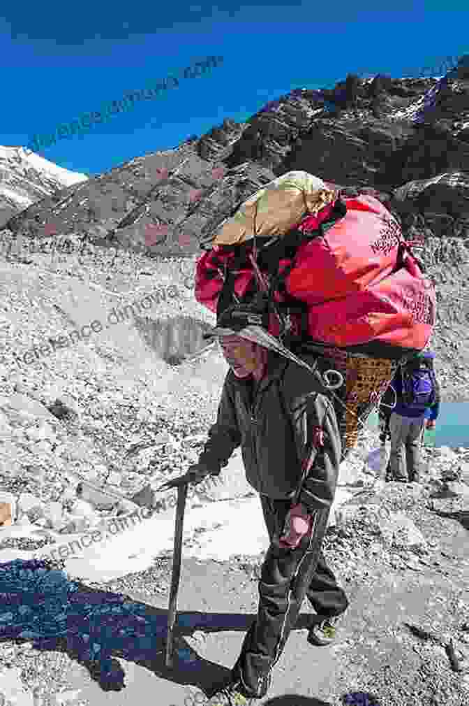 A Sherpa Porter Carrying Heavy Loads Along A Mountain Trail In The Everest Region, Nepal The Photographer S Guide To The Everest Region Of Nepal