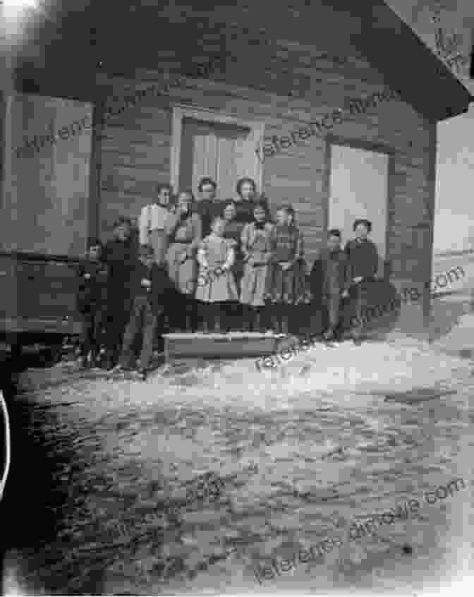 A Woman Stands In A Small Wooden Schoolhouse, Surrounded By Eager Children. Christmas Gift Of Love: Historical Western Romance