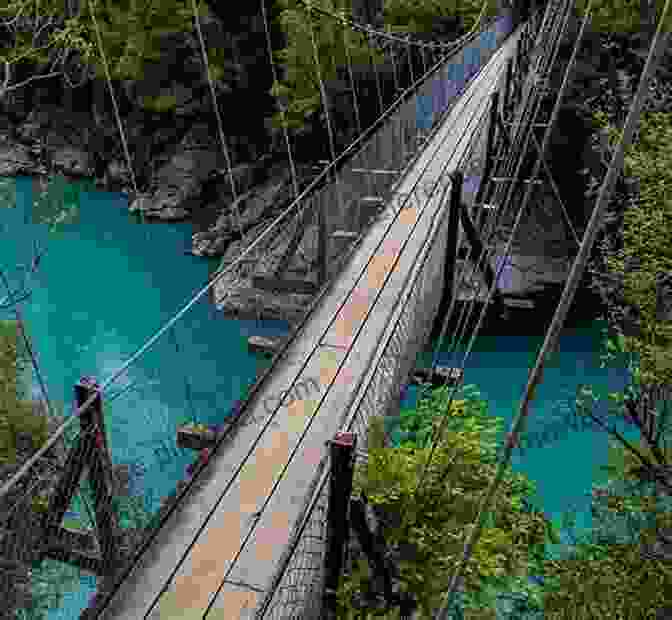 Hikers Crossing A Swing Bridge Suspended Over A Fast Flowing River In New Zealand Face Of The Mountain ~ True New Zealand Alpine Hiking Adventures: True New Zealand Alkpine Hiking Adventures