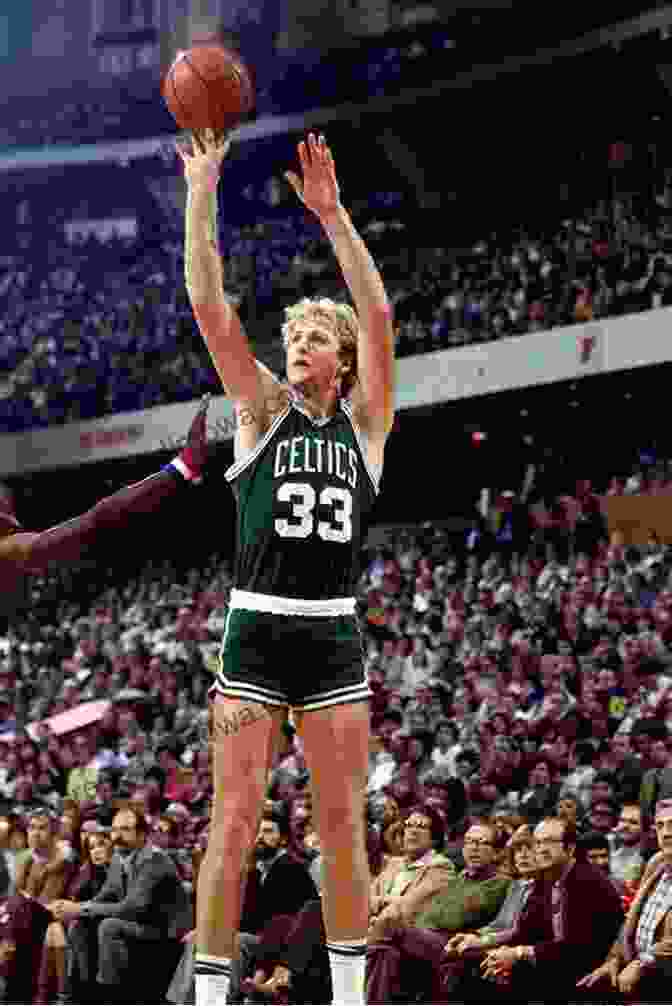 Larry Bird Soaring Through The Air For A Dunk, His Iconic Celtics Jersey And Headband Highlighted Legendary Aura Larry Bird: Learn About His Work Ethic And Competitiveness